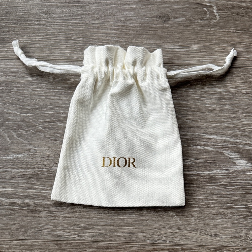DIOR Cream Drawstring Bag with Gold Logo